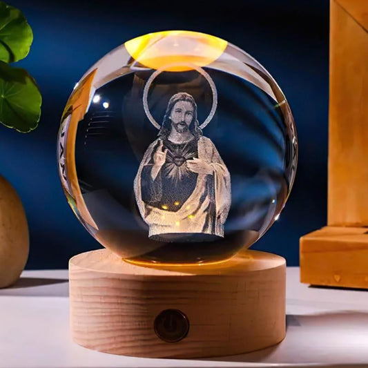 Christian Home Decor Crystal Ball on Wooden Base glowing softly.